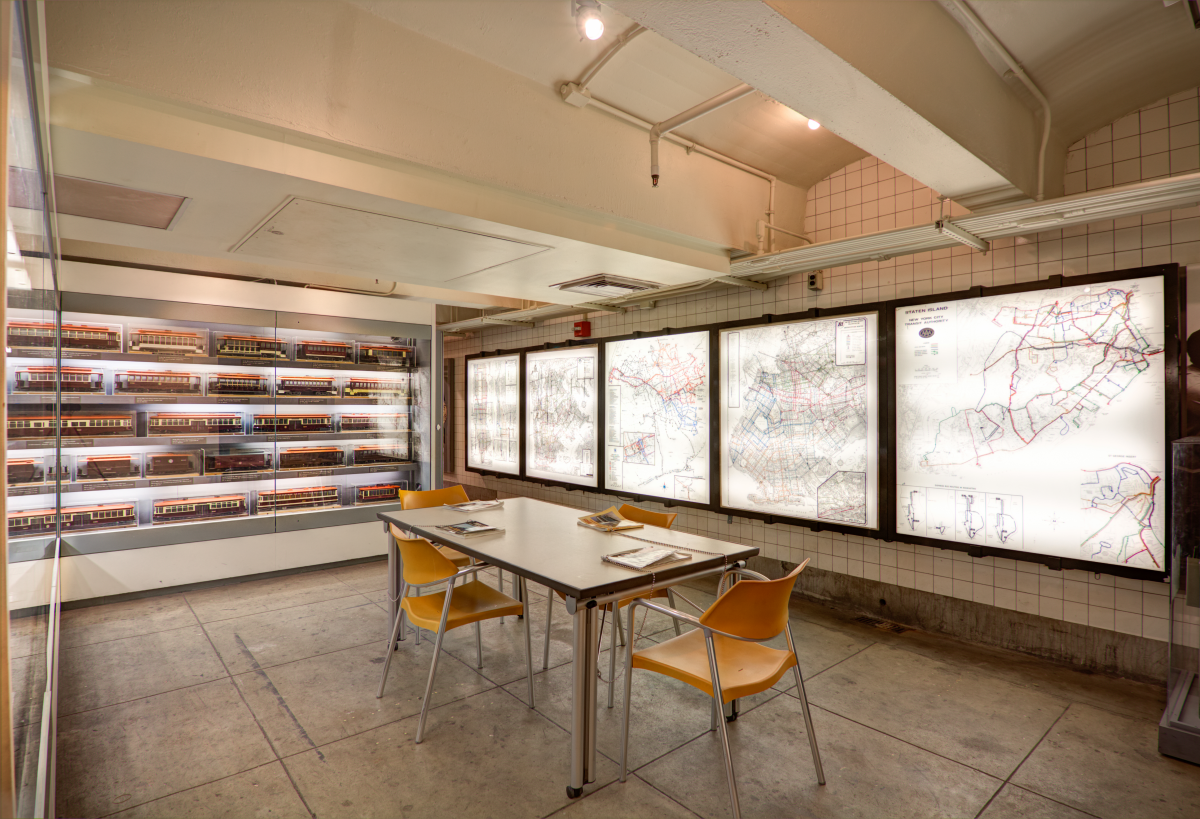 Table and chairs with trolley models and backlit maps of trolley system