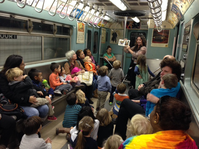 Educator Polly reads a story to our youngest transit fans.