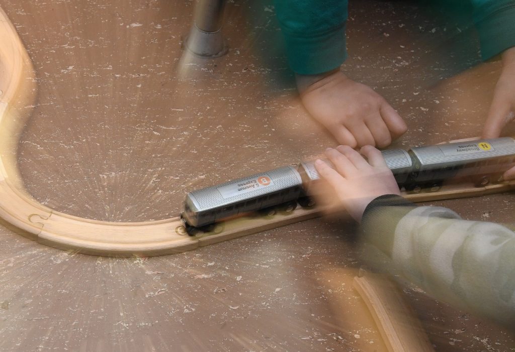 Sleuths Working Together to Build Wooden Train Tracks - Photo by Marc Hermann