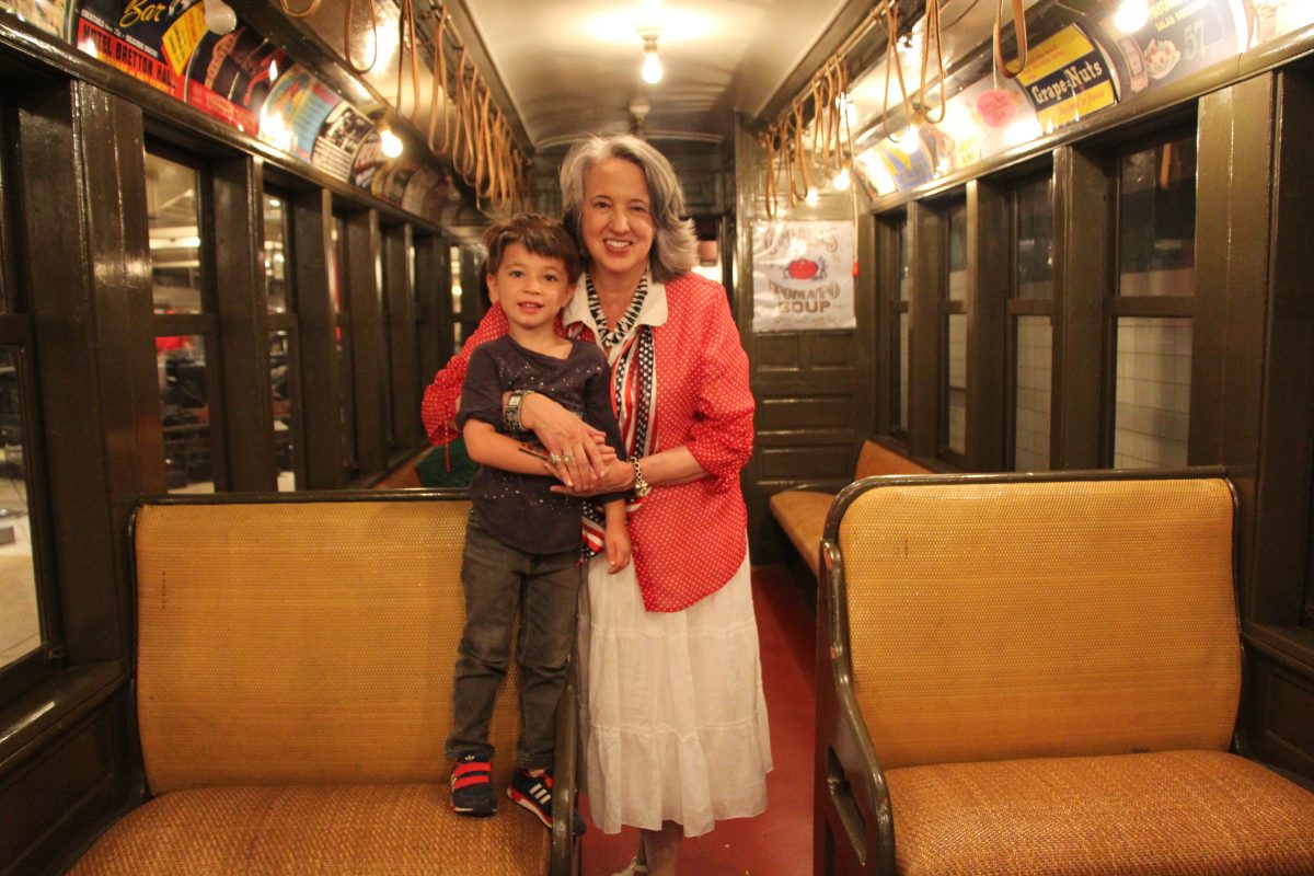 Boy and Grandmother in a vintage train at our Party on Wheels fundraiser