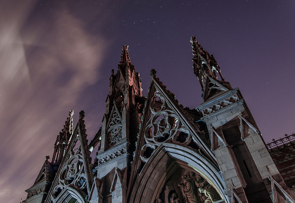 Gothic Arches below a purple sky with stars, photo by Steven Acres