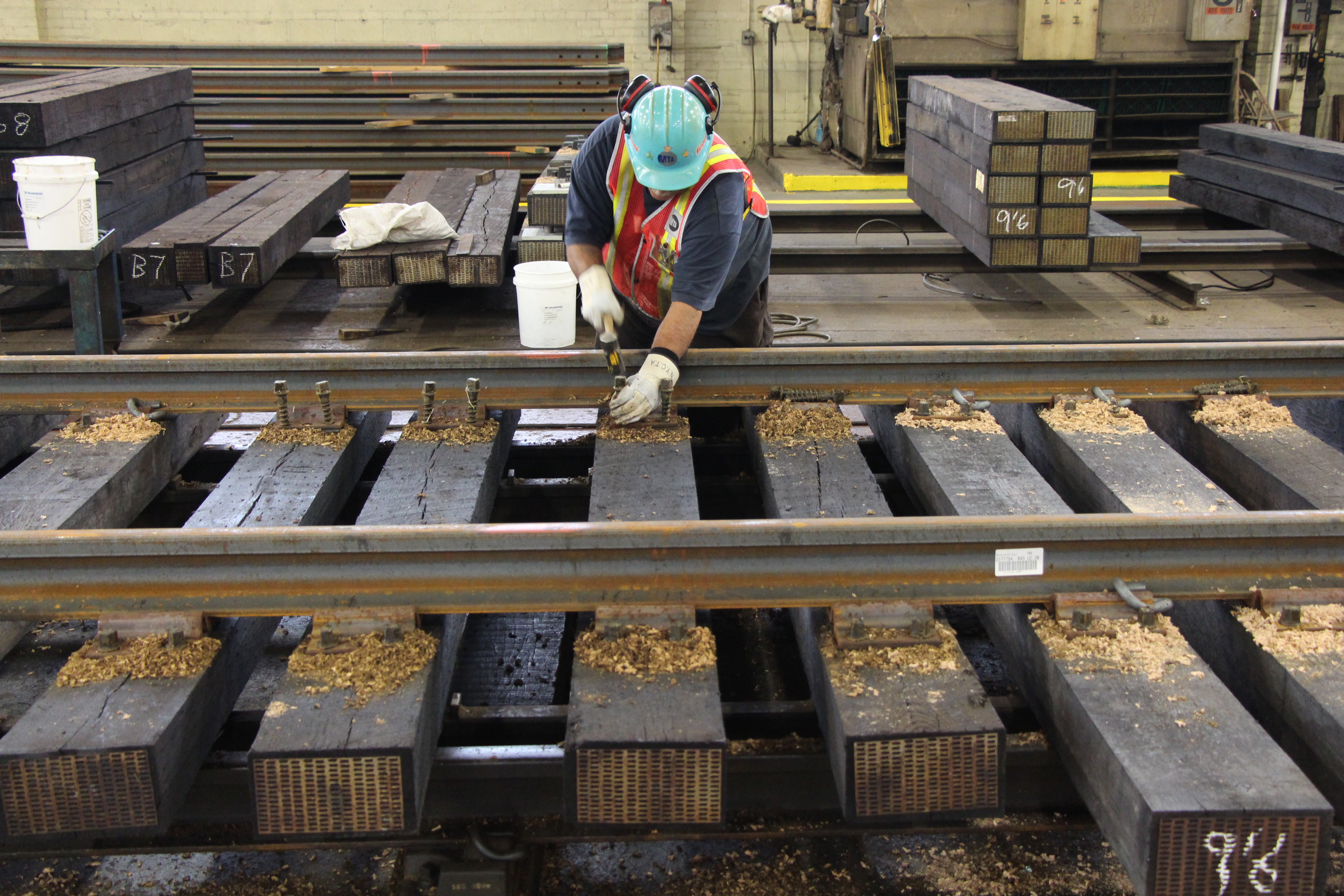 Worker repairing track at Linden Yard