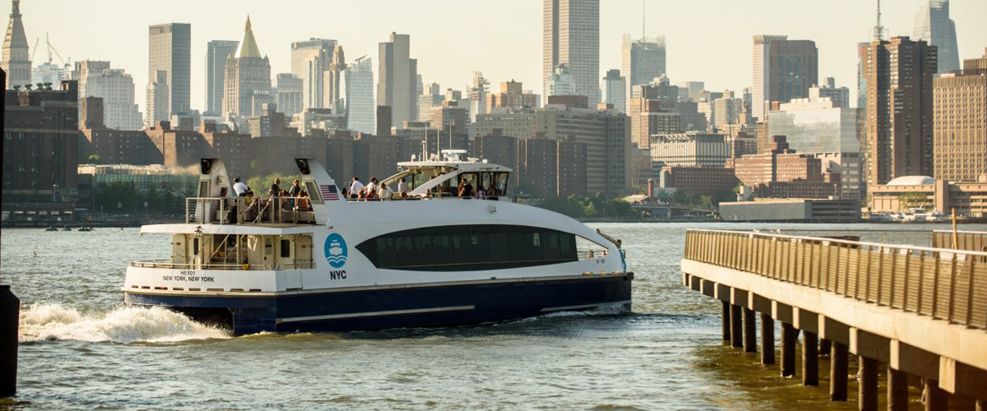 NYC Ferry in front of the Manhattan skyline