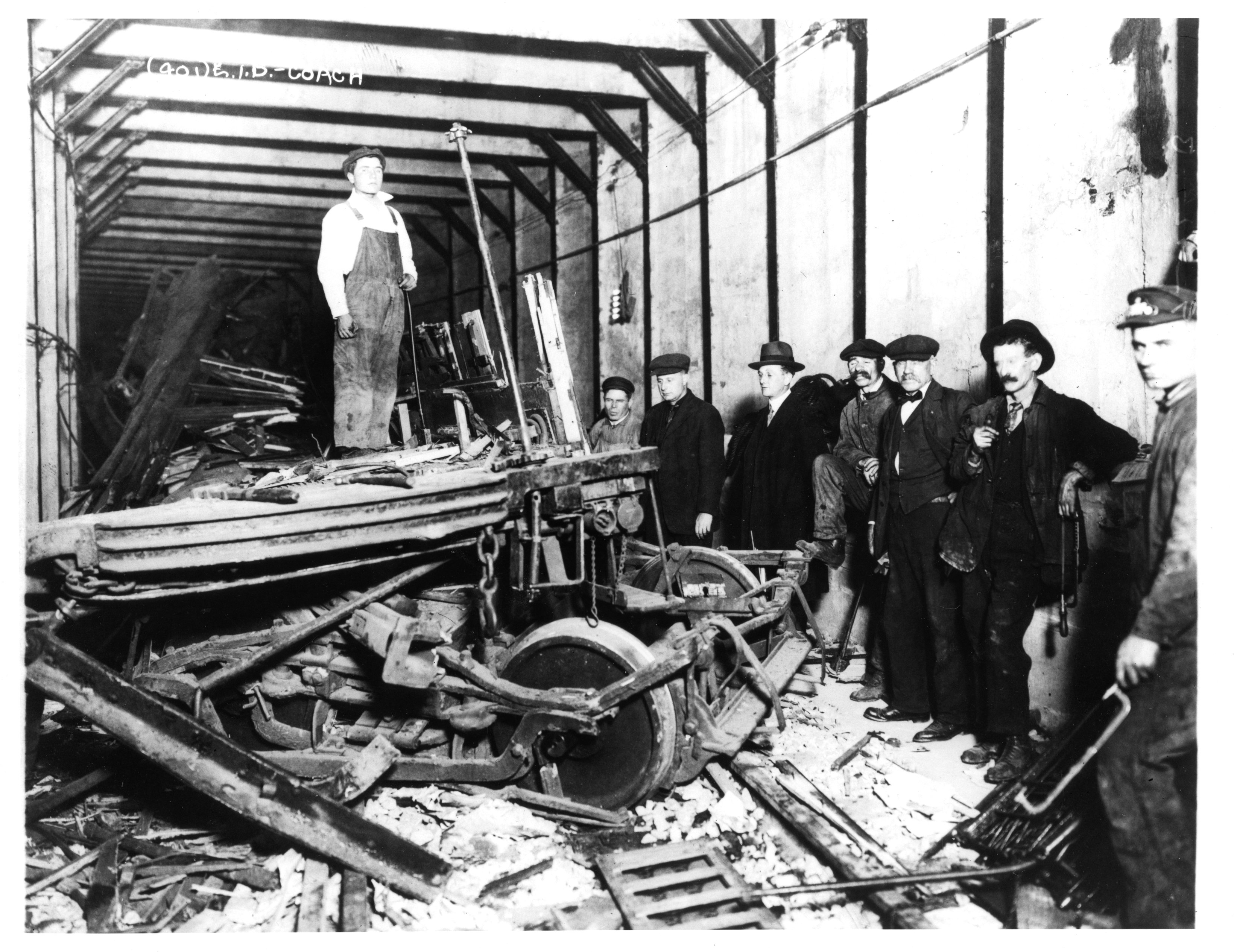 Workers and police stand among wreckage of the Malbone Street Wreck, 1918.