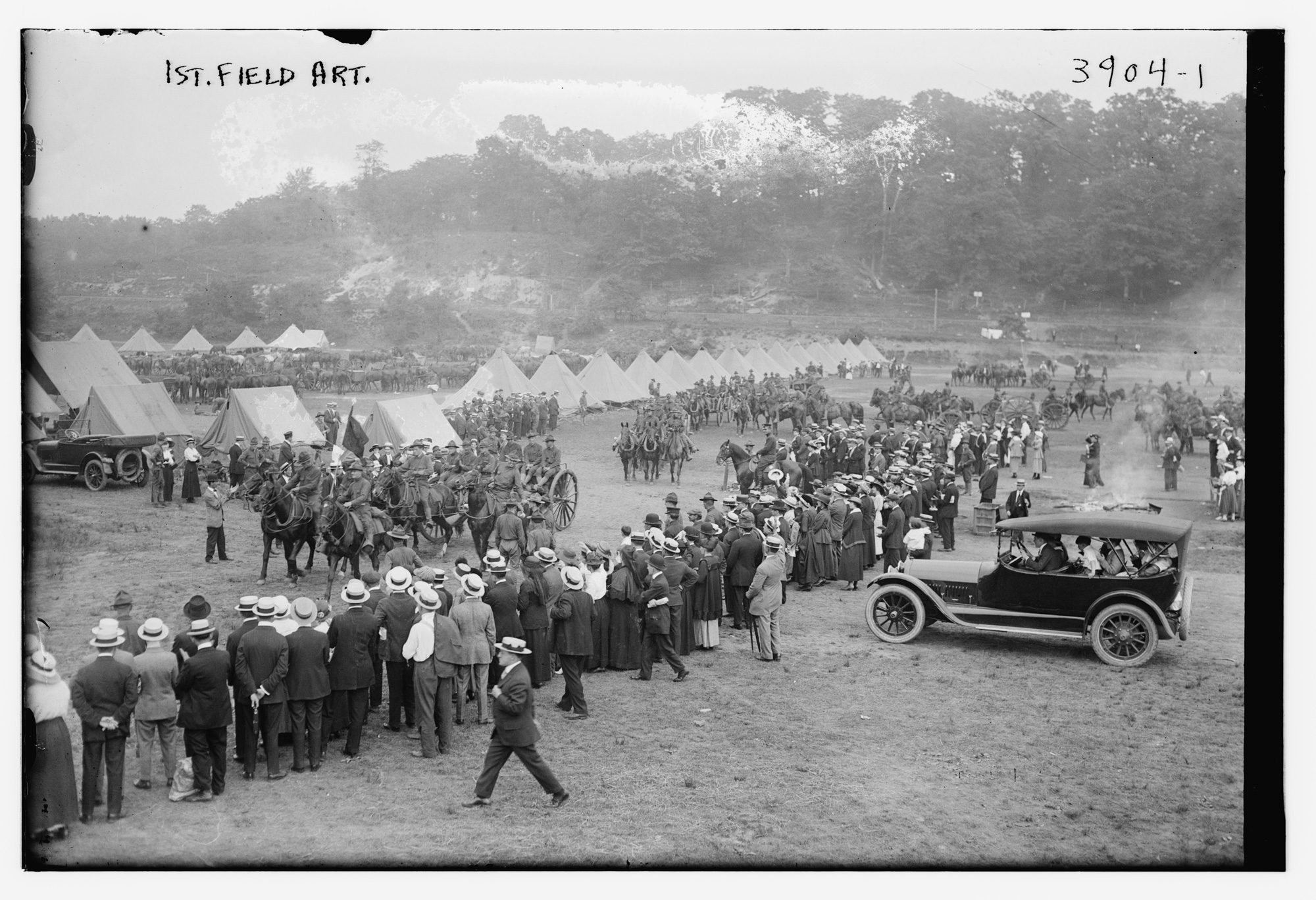 Photograph shows batteries of the 1st Field Artillery preparing to leave for Texas from their encampment at Van Cortlandt Park in New York, July 1916.