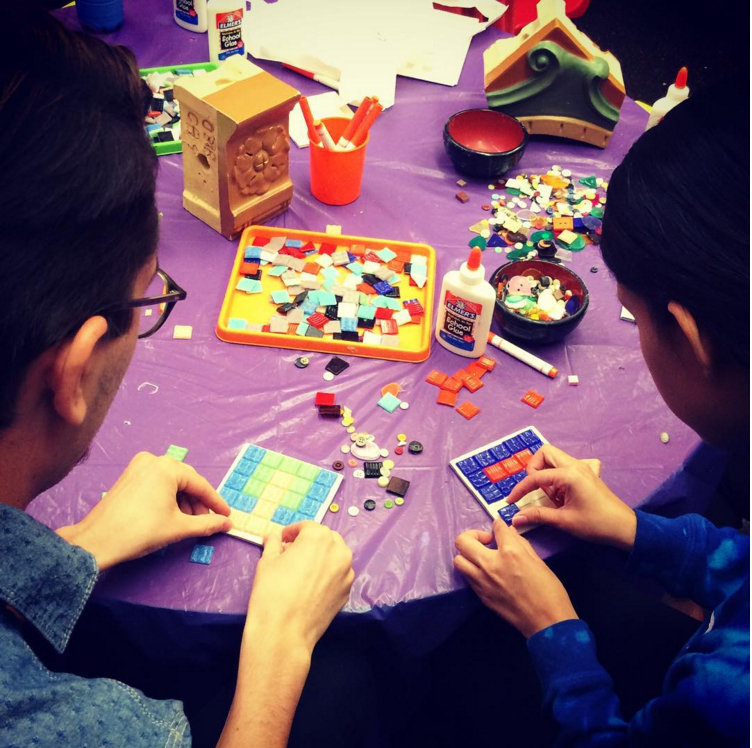Two children making art.