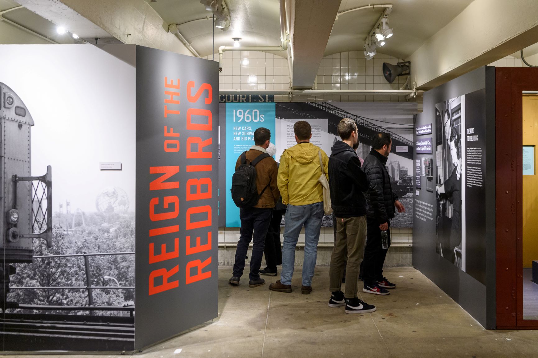 Reign of the Redbirds Exhibit Photo with Visitors, Photo by Filip Wolak