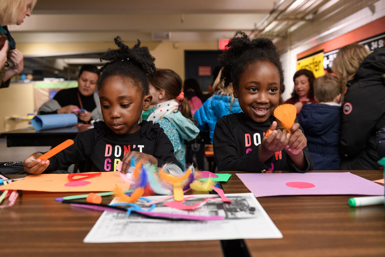 Two girls making art together