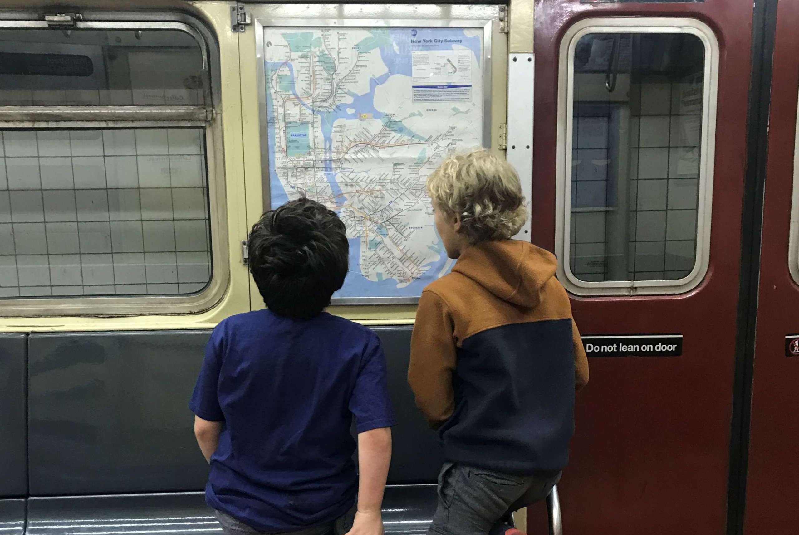 Two Sleuths examining vintage NYC Subway map
