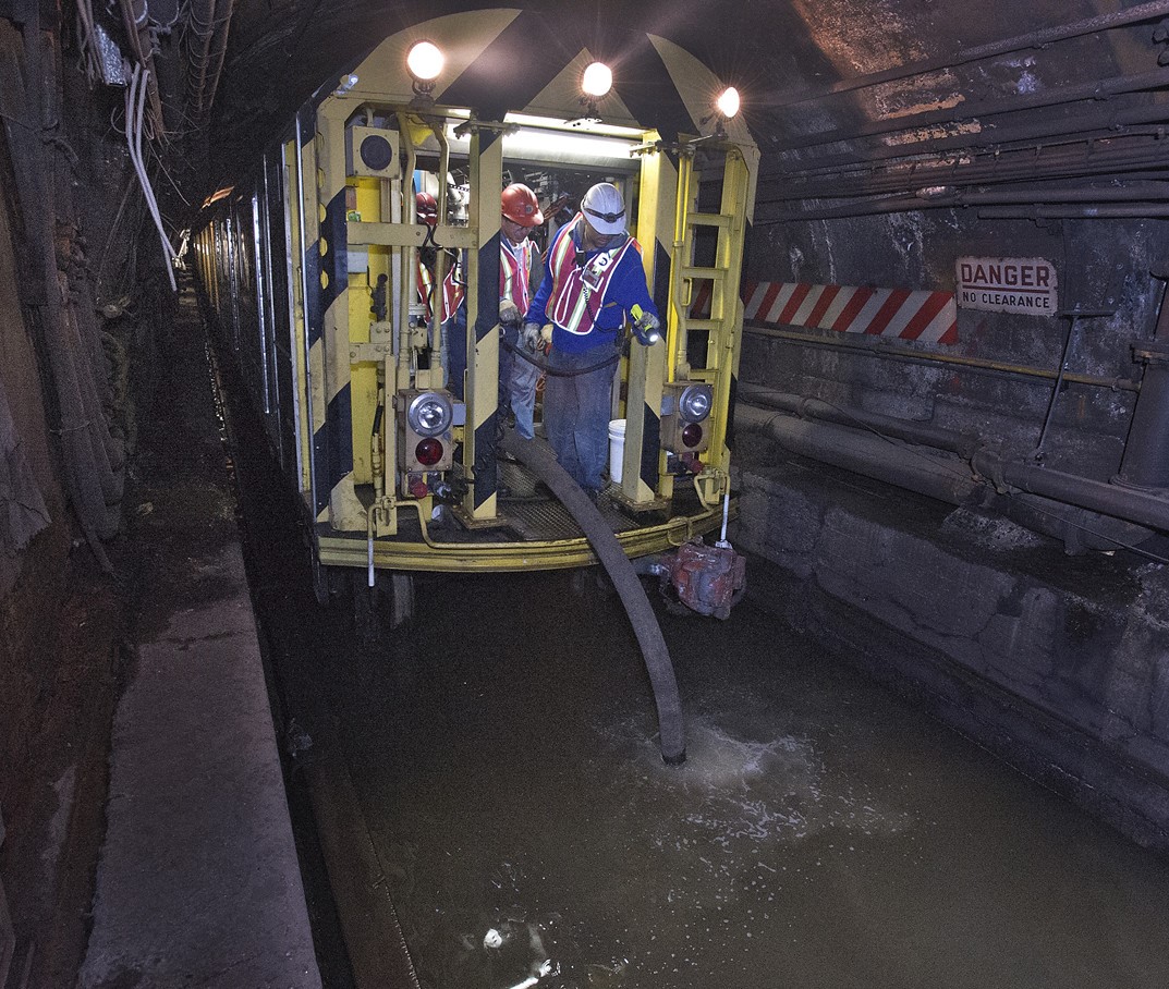 MTA workers drain tunnel