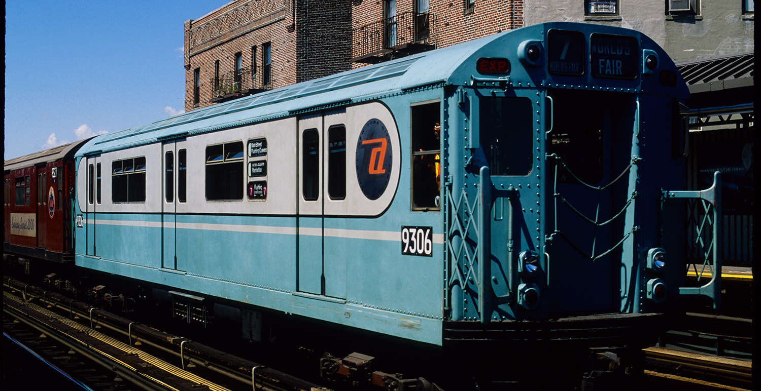 Bluebird #9036 in World's Fair paint scheme followed by Redbird Train