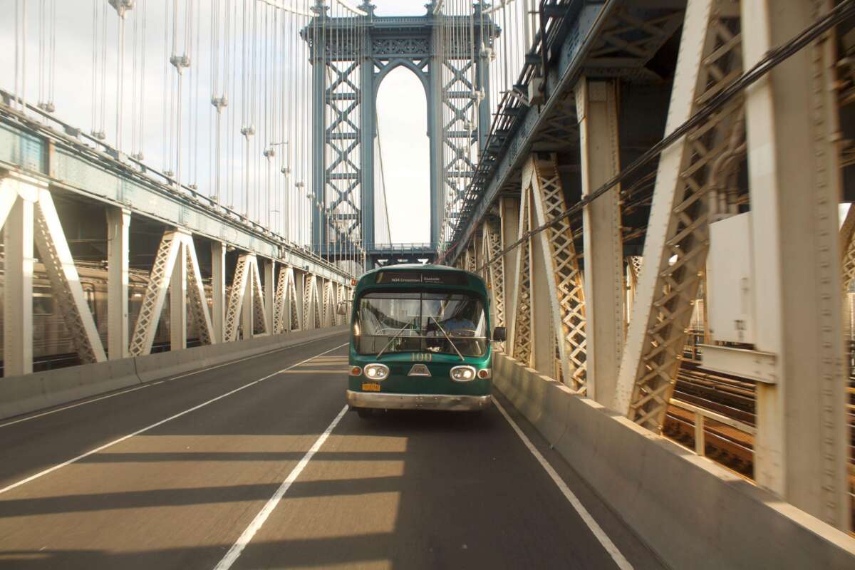 Bus #100 crossing a bridge