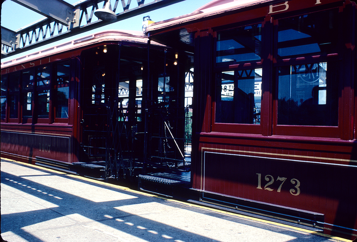 Color photograph of BU cars at station platform on a July 4th fan trip in 1980