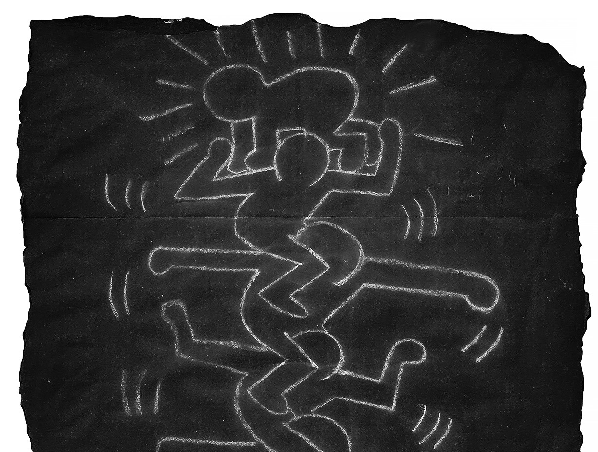 Example of Keith Haring subway chalk drawing featuring stacked figures outlined in white.