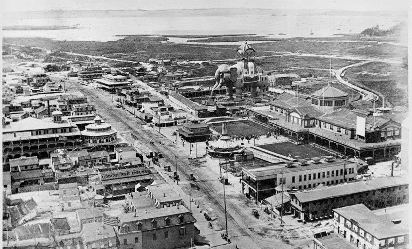 Aerial street view of Coney Island with Elephant Hotel visible.
