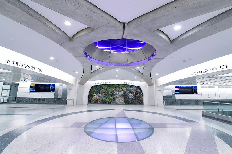 Grand Central Madison mezzanine with purple wayfinding light installation.