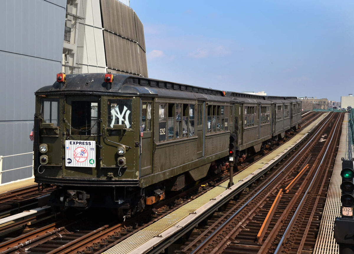 Lo-V train with Yankees decal on window is stationed in front of Yankee Stadium on a home opener nostalgia ride