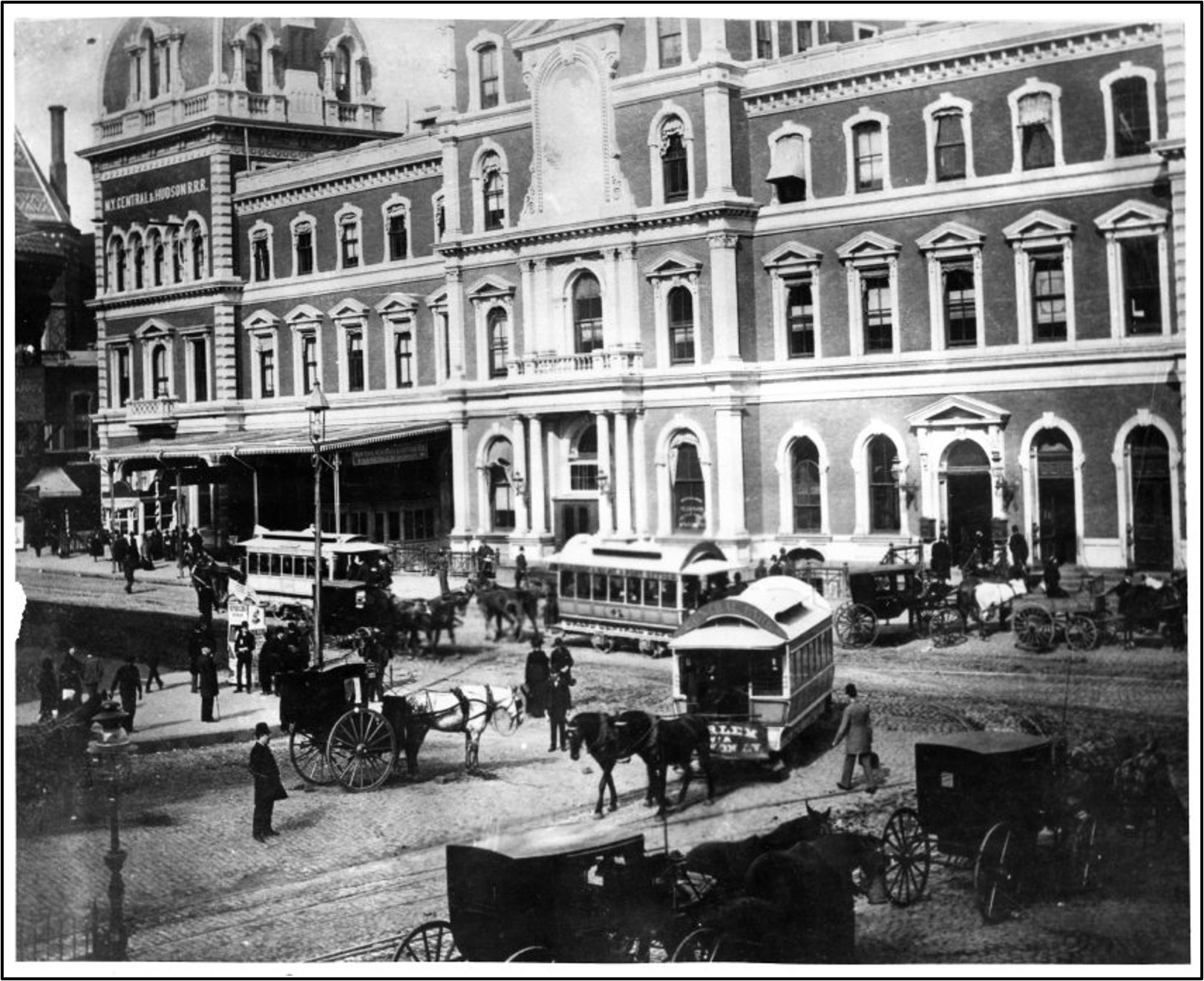 Facade of the Grand Central Depot and trolley lines along 42nd Street and Fouth Avenue.