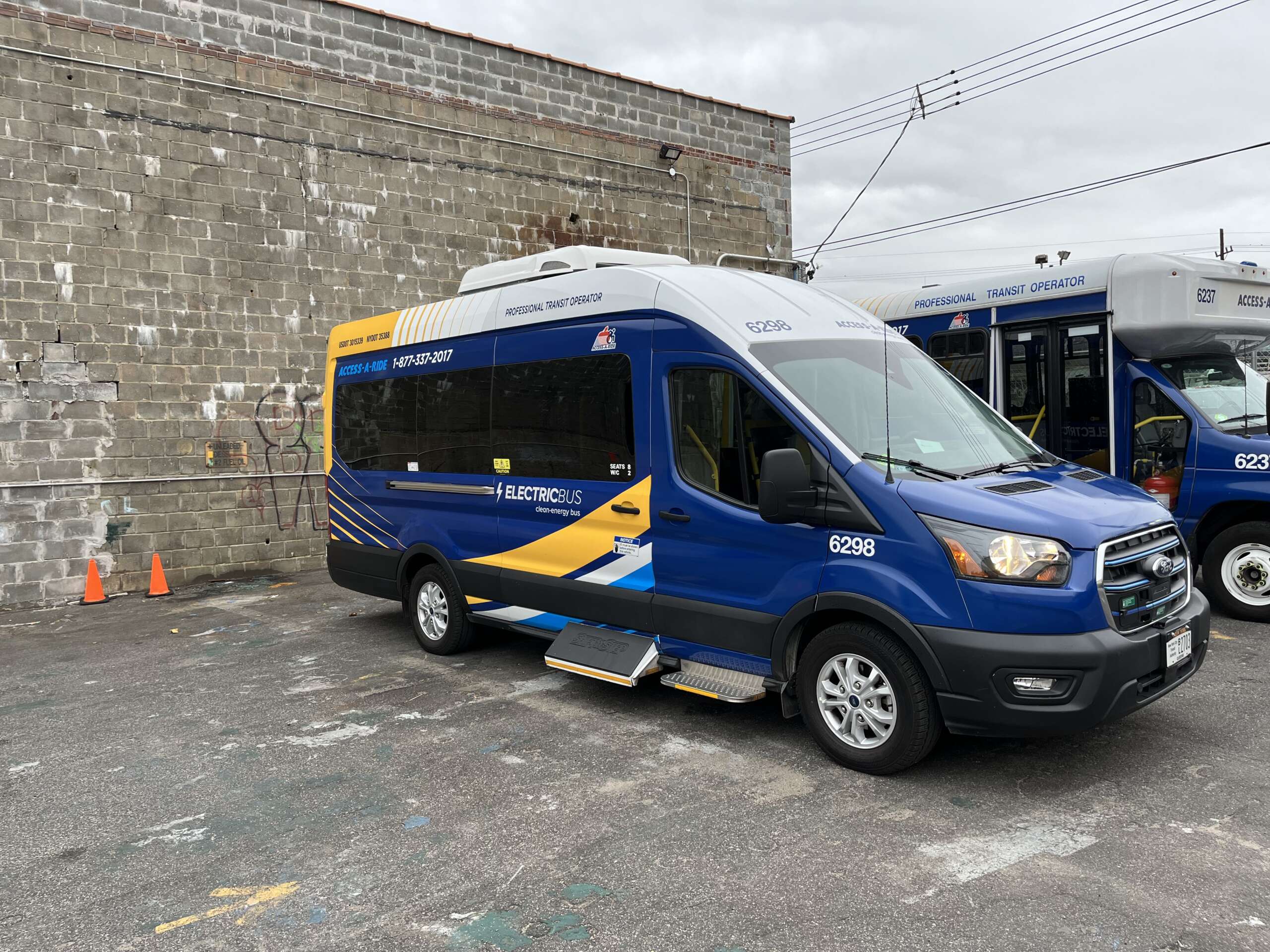 A blue and yellow van