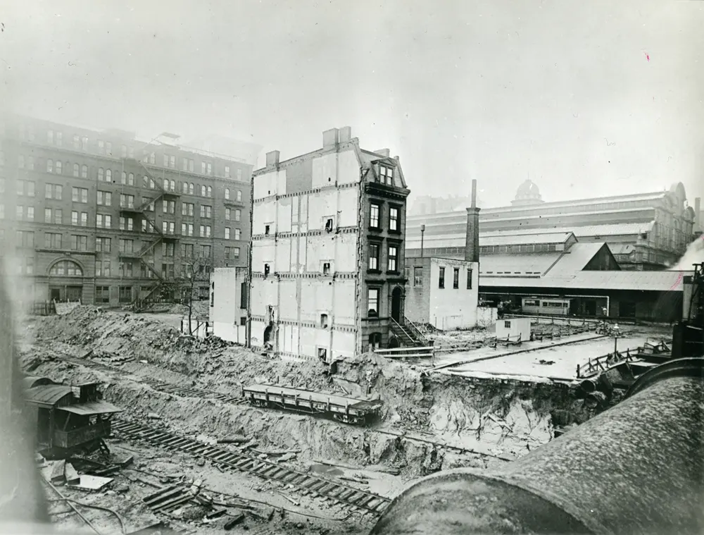 Black & white photo of the demolition of Brownstones