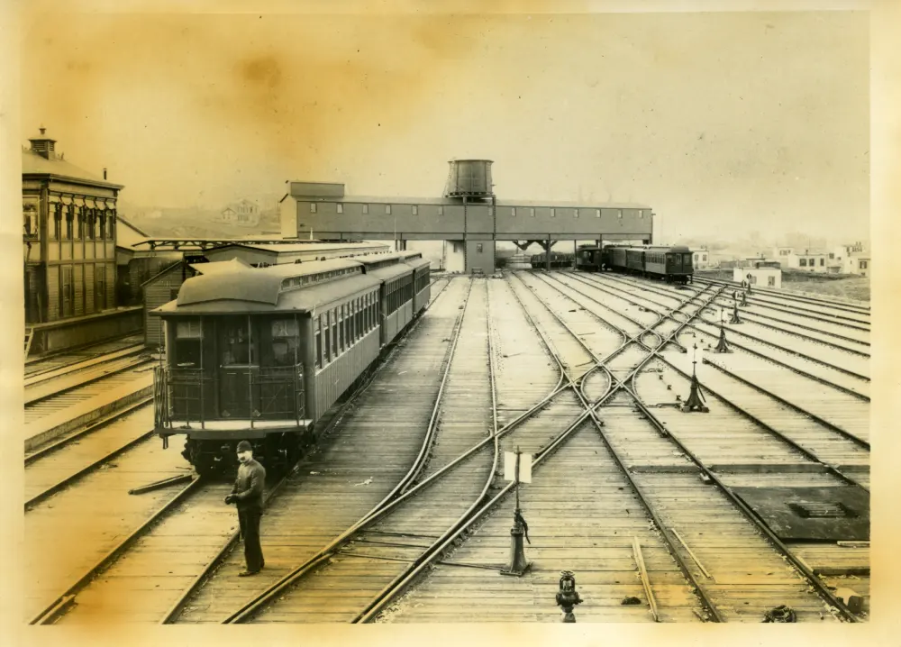 Sepia image of BU Car at a rail yard
