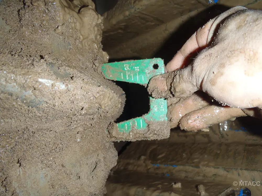 A measuring device showing worn TBM teeth