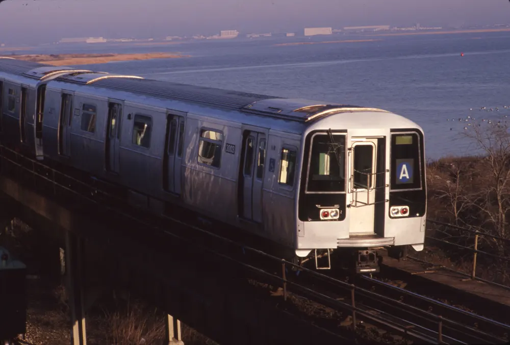 R110B with A route indicator travels over elevated tracks