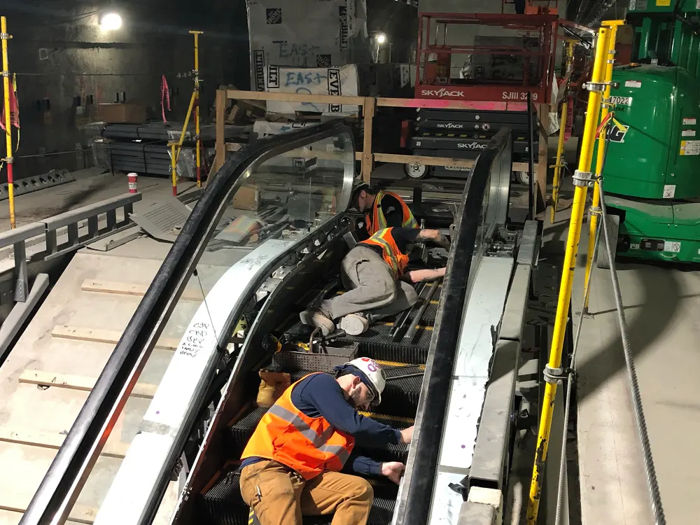 Men Installing escalators in the LIRR terminal