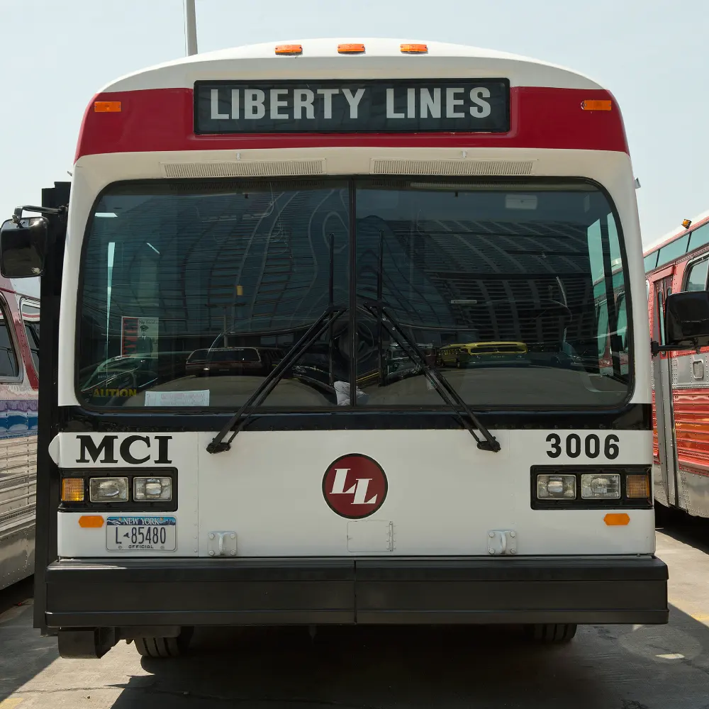 Red and white bus number 3006
