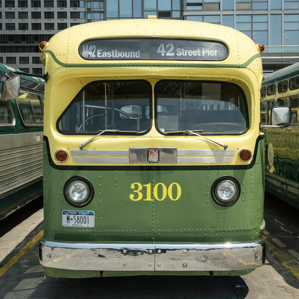Green and yellow bus number 3100