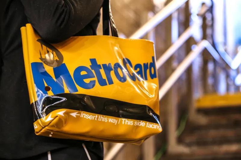 Person Carrying Yellow MetroCard Bag