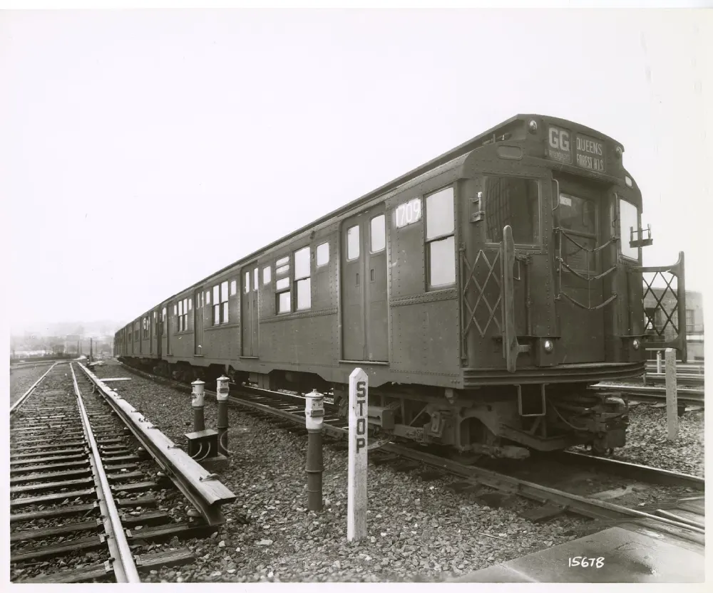 black & white photo of R9 car standing idle on the tracks