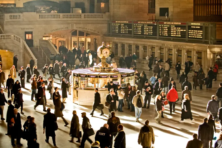 Light flows into Grand Central Terminal as commuters pass by