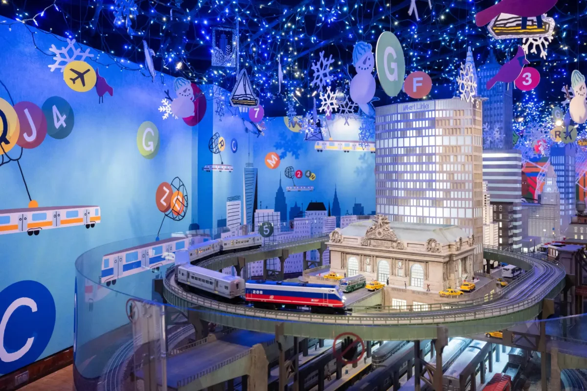 Holiday Train Show display with mini grand central terminal model and train on the tracks