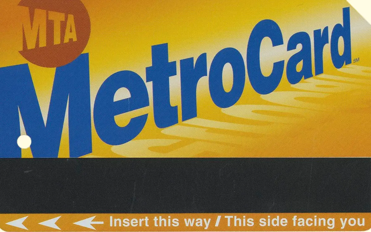 Gold MetroCard on pale yellow background