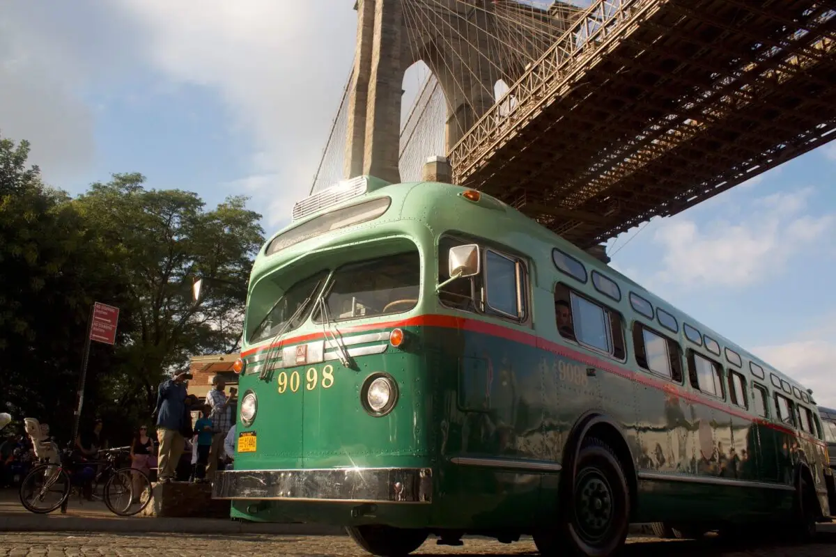 Bus 9098 sports a two-tone green exterior with a contrasting stripe, and was also the first type of bus in New York City equipped with sliding windows, fiberglass seats, and rear door safety exits.