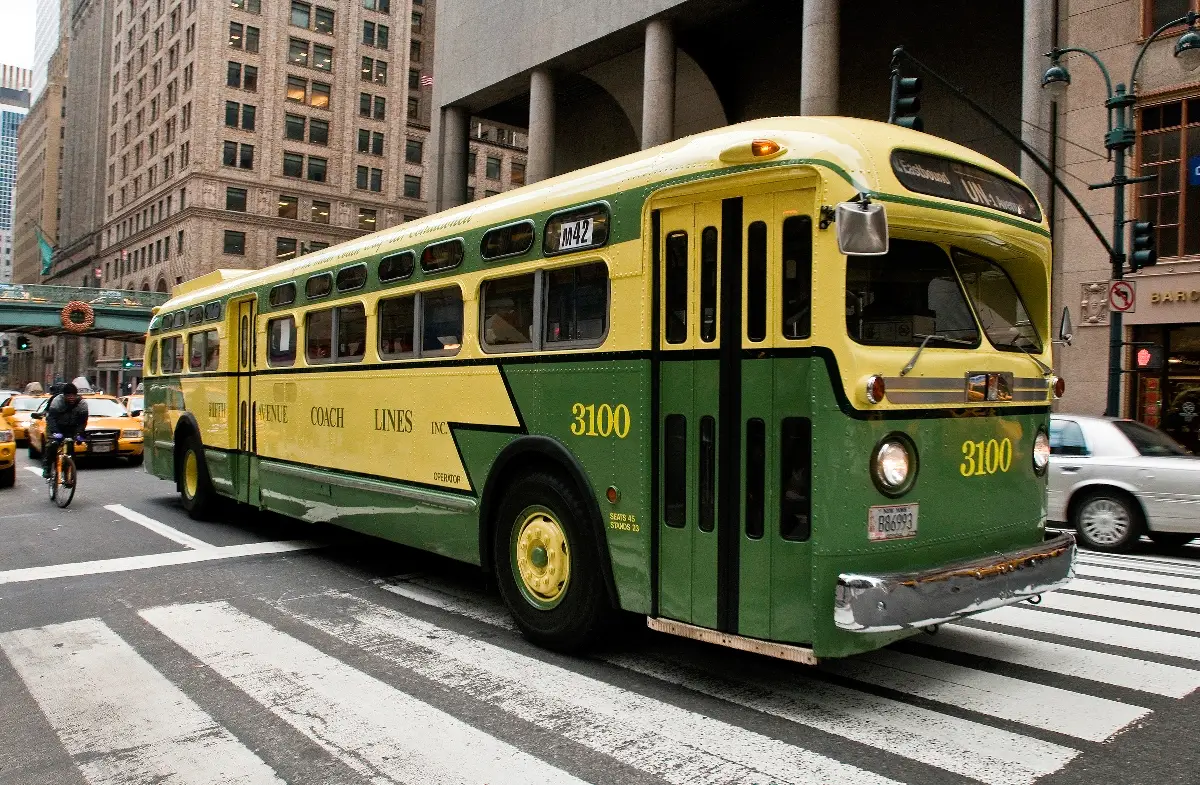 Bus 3100, a yellow and green stunner that features innovations introduced in the 1950s, including a push-type rear exit door, wrap-around seating in the rear, soft cushioned seats, and fluorescent lighting.