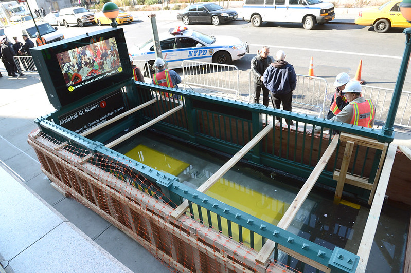 Flood mitigation cover being tested over a subway entrance.