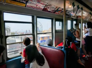 Kids looking out window of R1/9 car