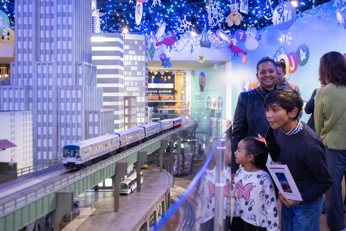 Family exploring the 2025-2026 Holiday Train Show at Grand Central Terminal