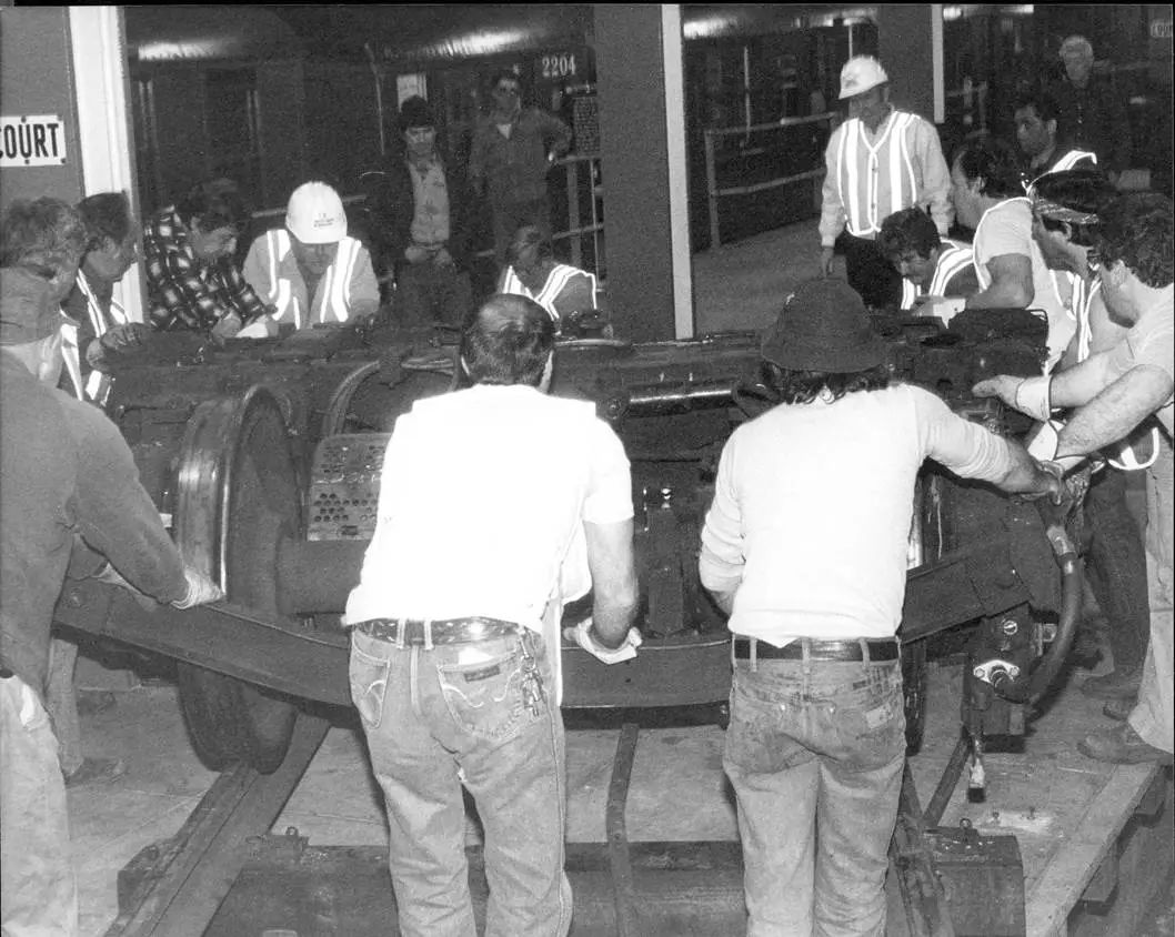 Men Moving the Motor Truck