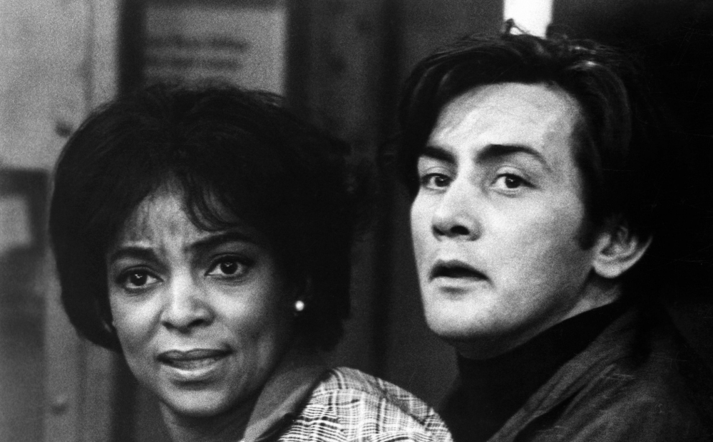 A man and a woman look concerned.