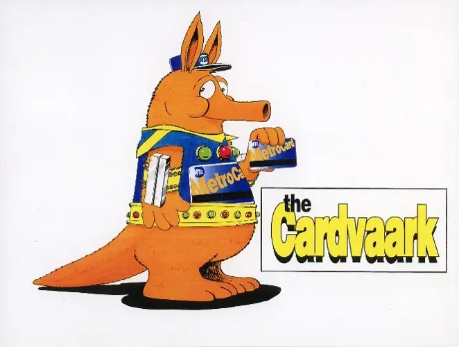 Orange aardvark named the Cardvaark holds a Metrocard and wears a metrocard uniform.